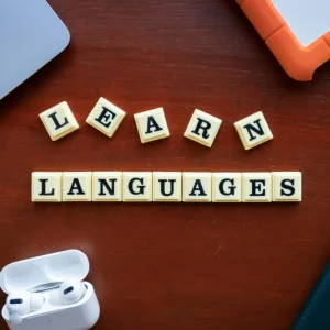 pexels-photo-14814047-14814047 Flat lay of language learning materials with gadgets promoting education.